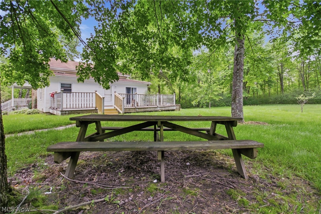 2591 Wayland Road Deerfield, OH 44411 - Photo 40 of 46 Expansive green lawn with mature trees and a wooded backdrop