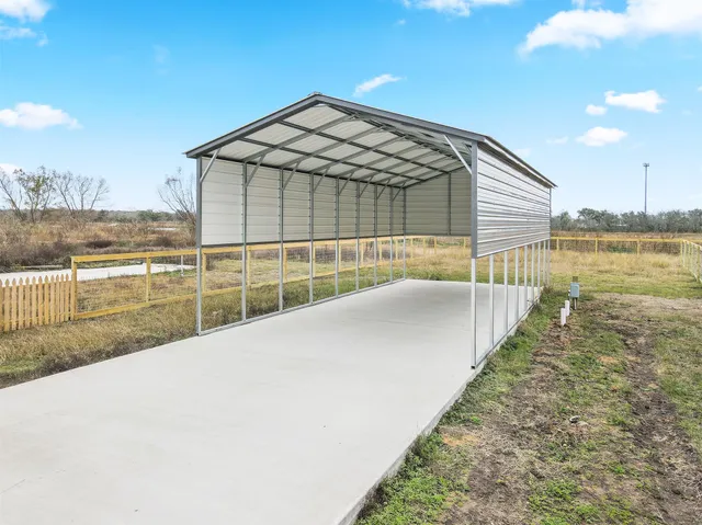 a view of swimming pool with outdoor seating and lake view