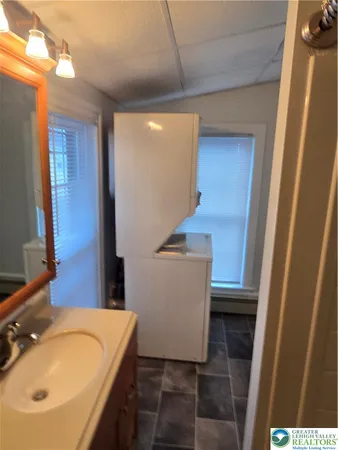 a bathroom with a sink and mirror