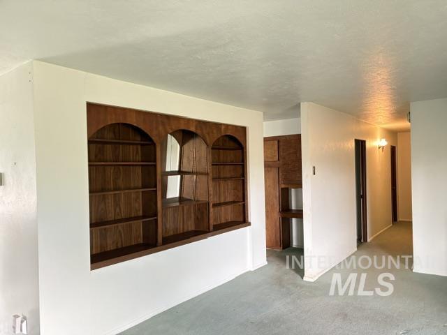 555 Cemetery Road Cambridge, ID 83610 - Photo 3 of 41 Built-in wood-finish shelving with arched openings