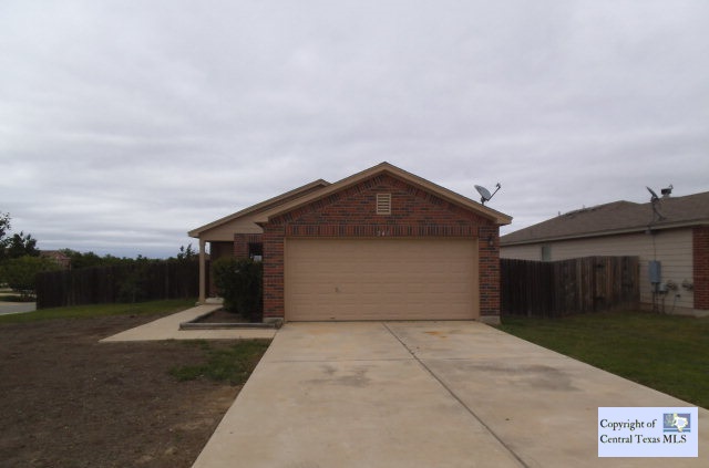a view of garage yard and balcony