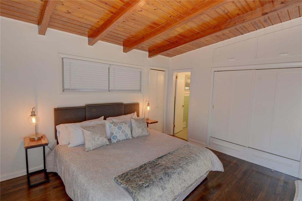 3206 Laventure Drive Chamblee, GA 30341 - Photo 20 of 39 a bedroom with a bed and wooden floor