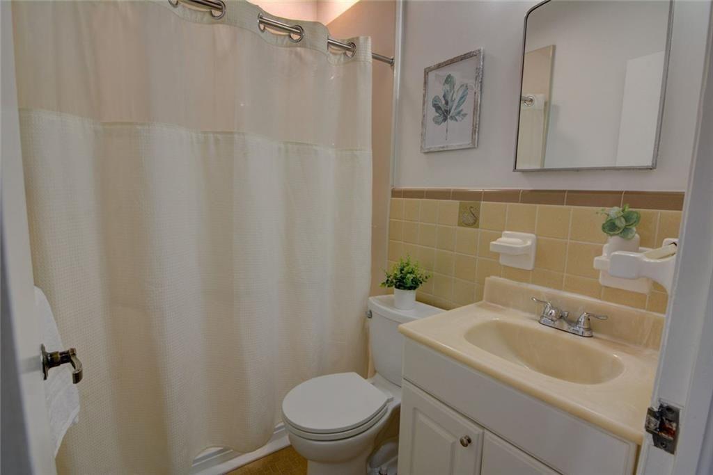 3206 Laventure Drive Chamblee, GA 30341 - Photo 23 of 39 a bathroom with a toilet sink and mirror