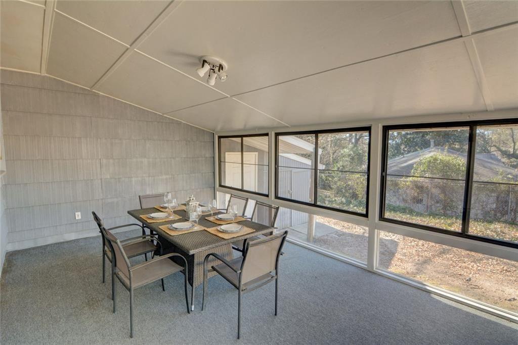 3206 Laventure Drive Chamblee, GA 30341 - Photo 27 of 39 a dining room with furniture and large windows