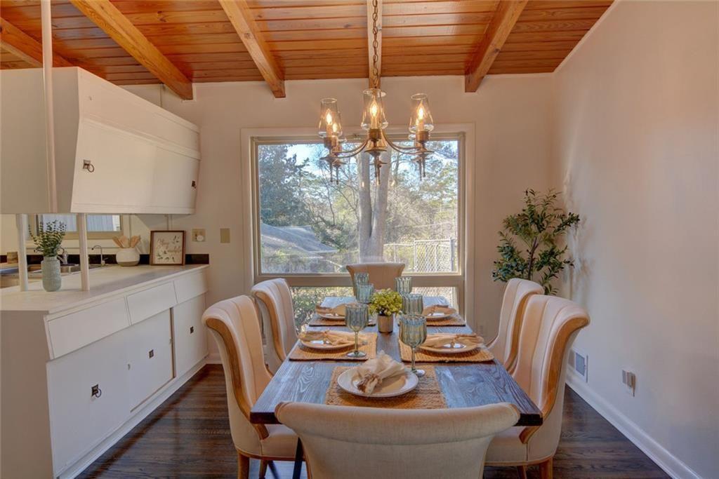 3206 Laventure Drive Chamblee, GA 30341 - Photo 9 of 39 a dining room with furniture a chandelier and window