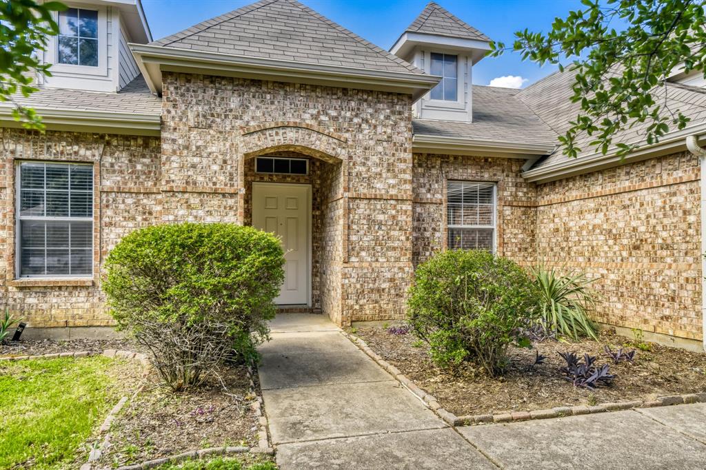 2617 Hereford Road Denton, TX 76210 - Photo 3 of 27 a front view of a house with garden