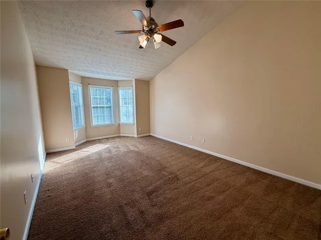 a bathroom with a tub shower and a sink
