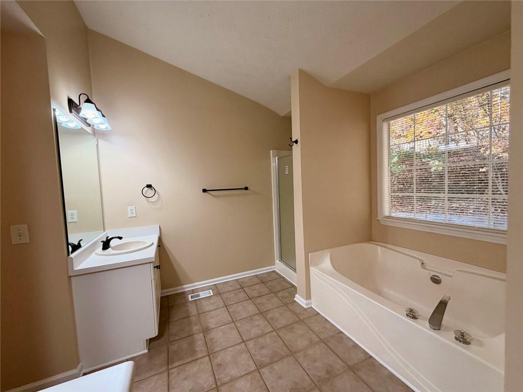 604 Victorian Circle Dallas, GA 30157 - Photo 13 of 25 a bathroom with a bathtub sink and toilet