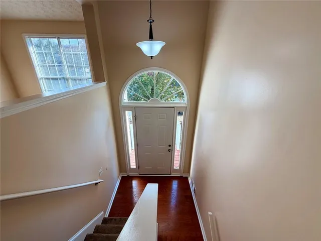 a view of a livingroom with a ceiling fan and window