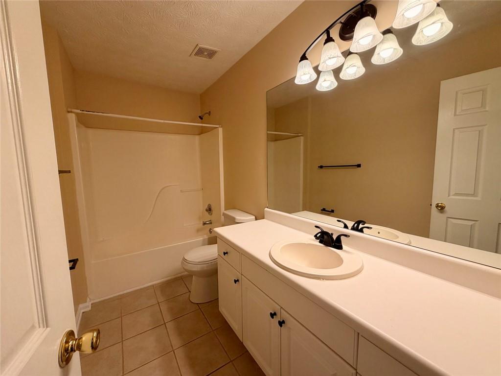 604 Victorian Circle Dallas, GA 30157 - Photo 7 of 25 a bathroom with a sink a toilet and shower