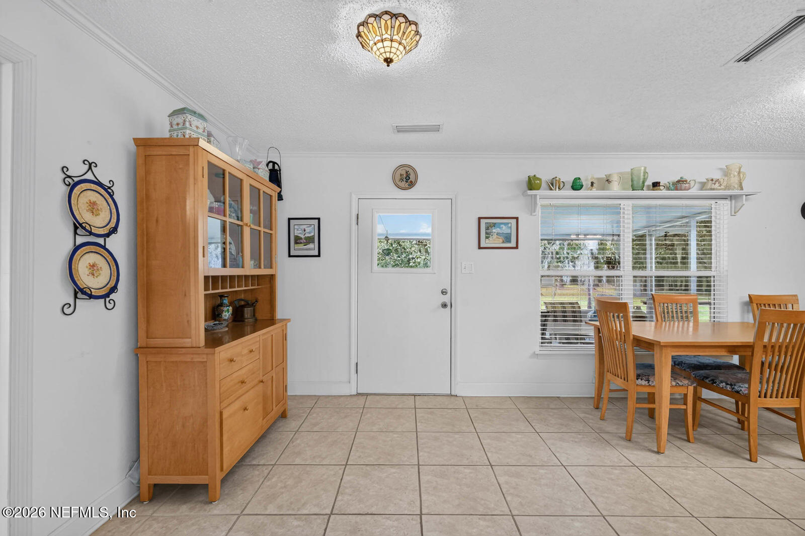 1950 Lightsey Road St. Augustine, FL 32084 - Photo 13 of 57 a view of a livingroom with furniture cabinet and front door
