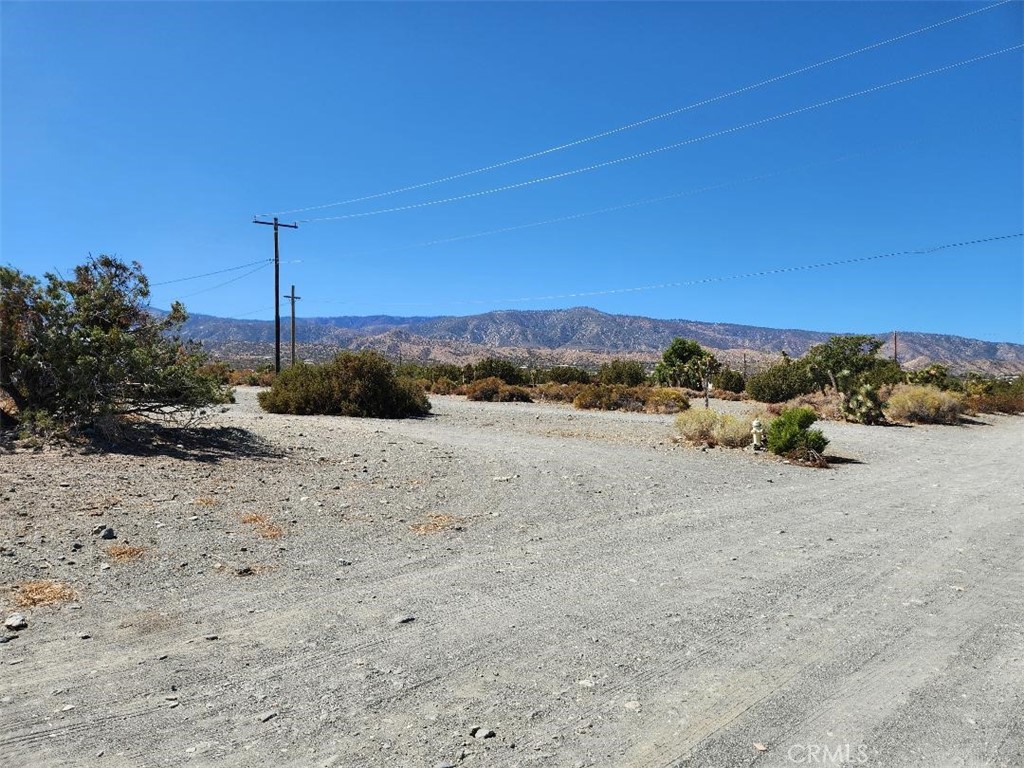 12 Cambria Road Pinon Hills, CA 92372 - Photo 12 of 12 a view of a road with a building in the background