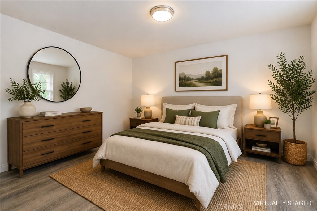 19451 Eagle Ridge Lane Porter Ranch, CA 91326 - Photo 28 of 59 a bedroom with a bed and a mirror on dresser