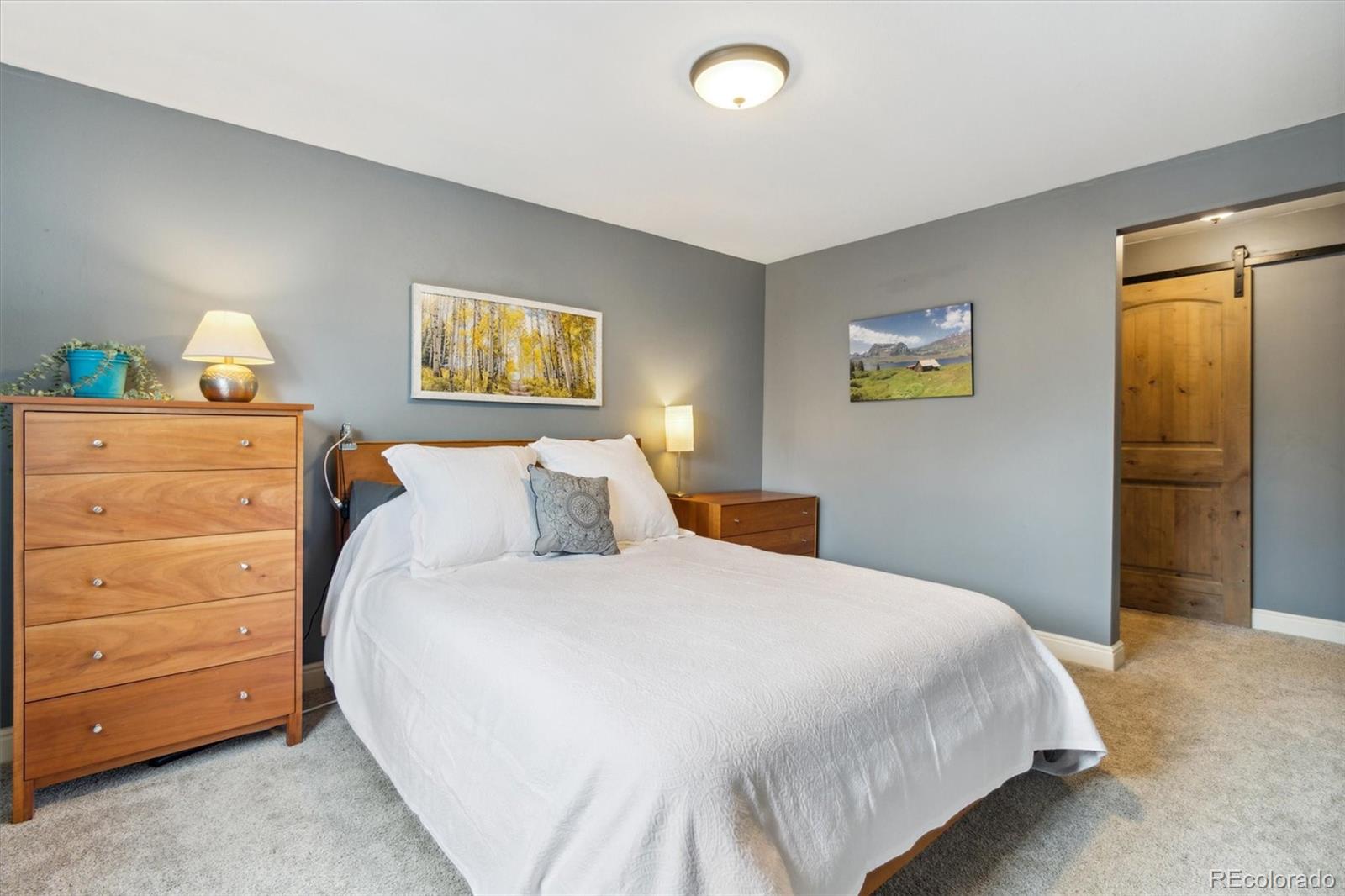 779 Aspen Way Evergreen, CO 80439 - Photo 12 of 49 a bedroom with a bed and a window