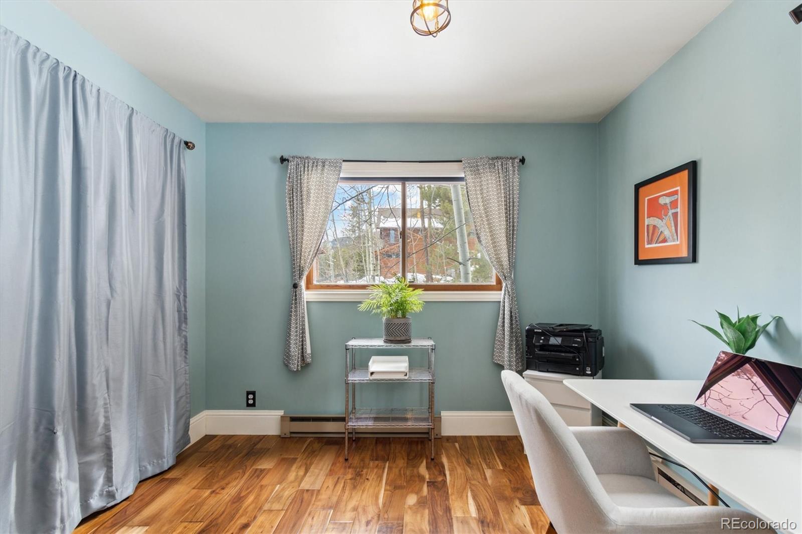 779 Aspen Way Evergreen, CO 80439 - Photo 15 of 49 a room with a bed and a window