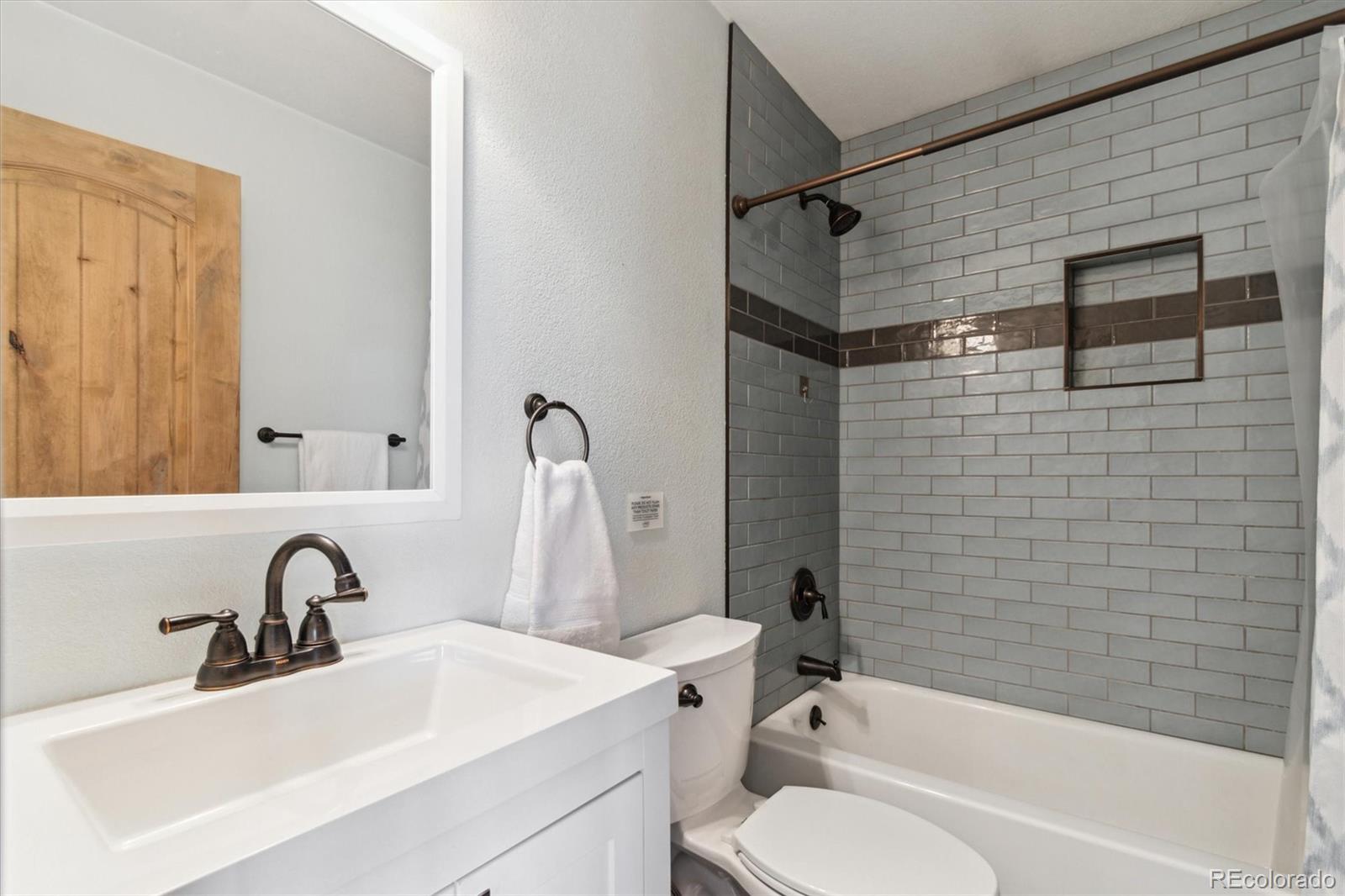 779 Aspen Way Evergreen, CO 80439 - Photo 18 of 49 a bathroom with a sink toilet and shower