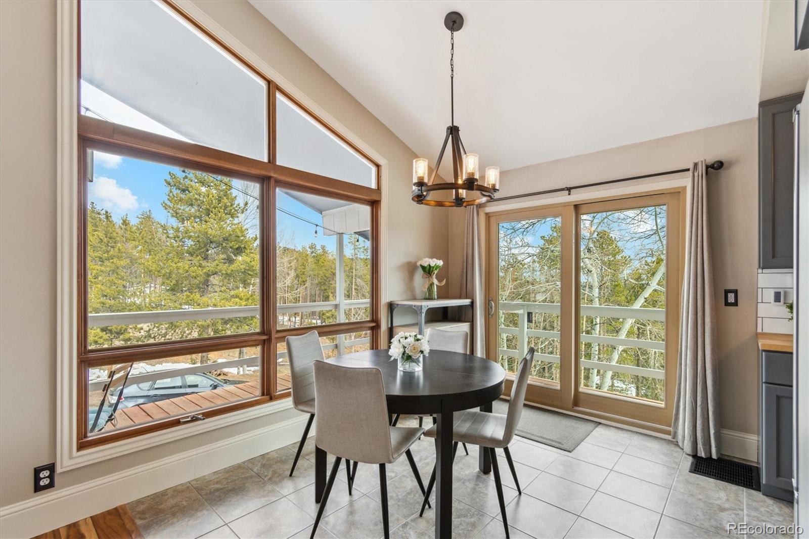 779 Aspen Way Evergreen, CO 80439 - Photo 2 of 49 a view of a dining room with furniture window and outside view