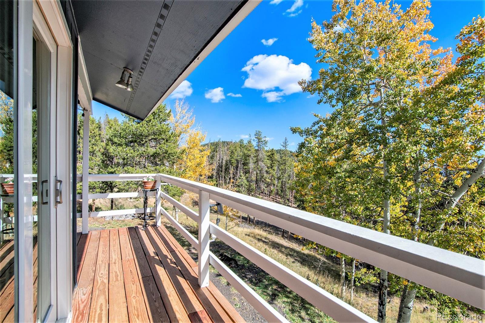 779 Aspen Way Evergreen, CO 80439 - Photo 30 of 49 a view of balcony with wooden floor
