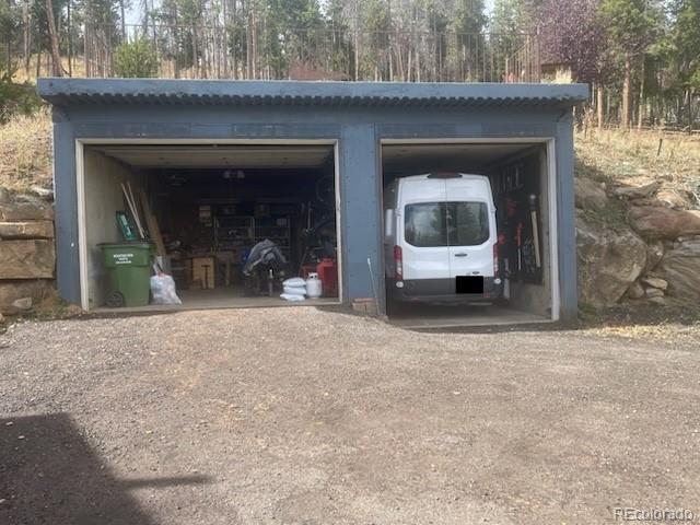 779 Aspen Way Evergreen, CO 80439 - Photo 34 of 49 a front view of a house with a yard