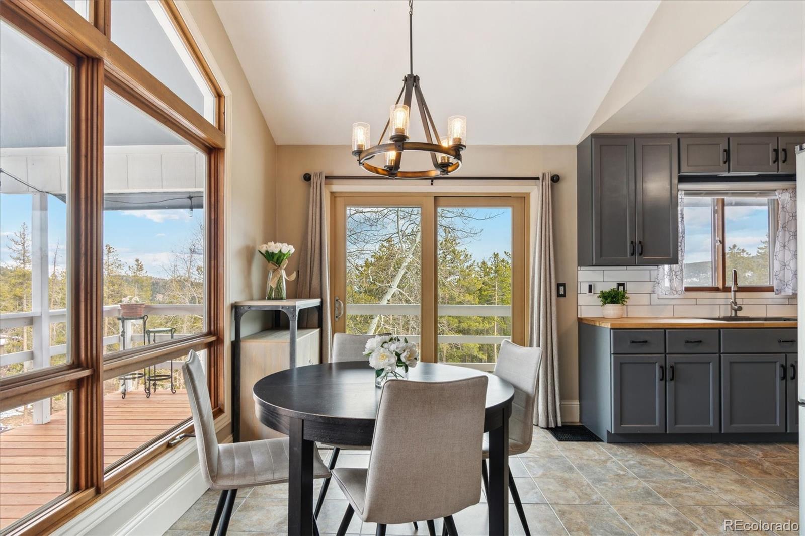 779 Aspen Way Evergreen, CO 80439 - Photo 4 of 49 a view of a dining room with furniture window and outside view