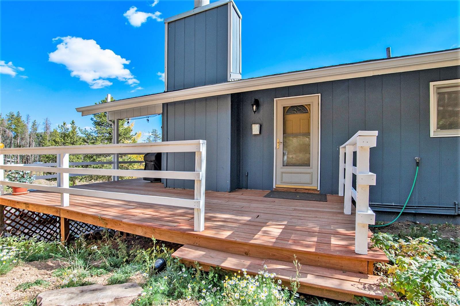 779 Aspen Way Evergreen, CO 80439 - Photo 41 of 49 a front view of a house with a yard