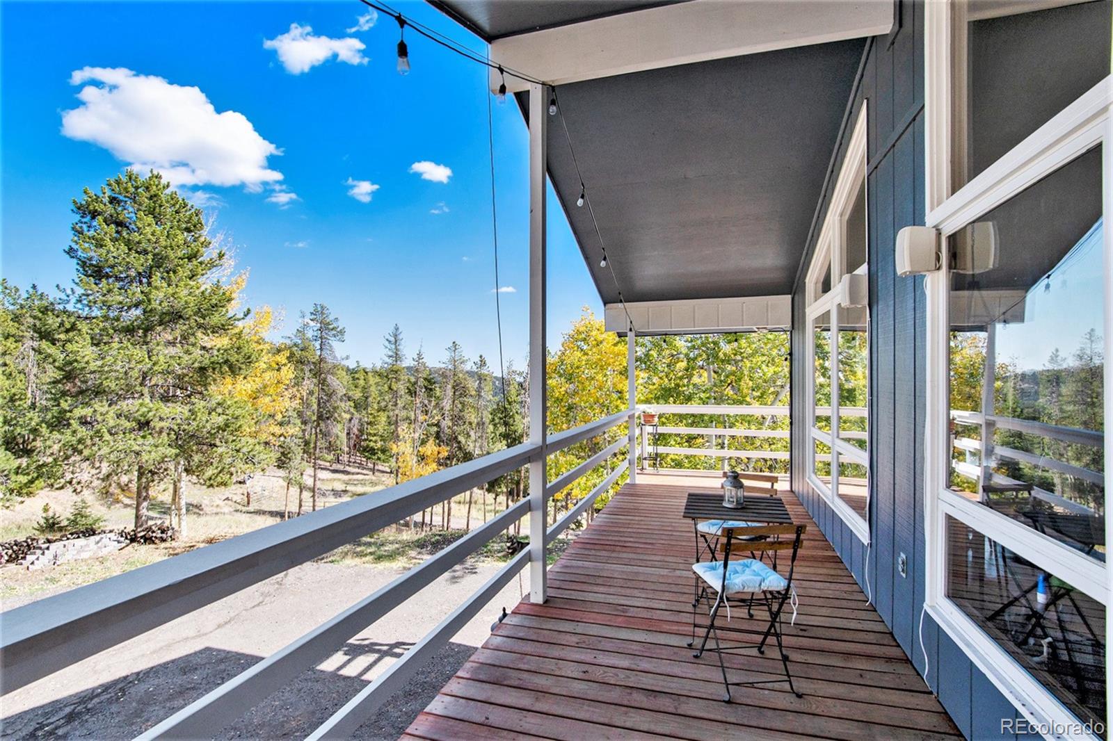 779 Aspen Way Evergreen, CO 80439 - Photo 42 of 49 a view of a balcony with wooden floor