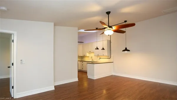 a kitchen with stainless steel appliances granite countertop a sink and a refrigerator