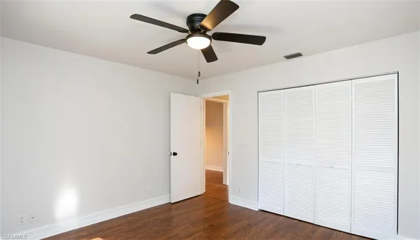 a view of room with window hardwood floor