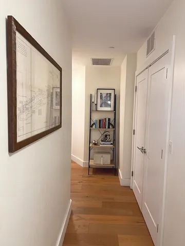 a view of a hallway with a bedroom