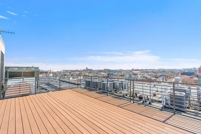 a view of a balcony with city view