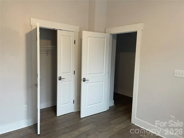 a bathroom with a sink mirror and a shower