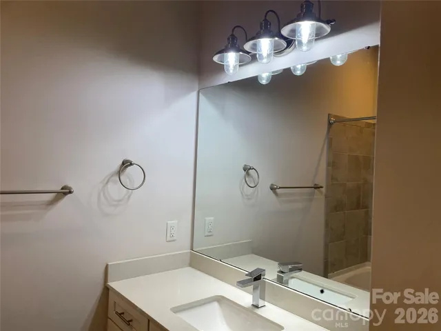 a bath tub sitting next to a shower