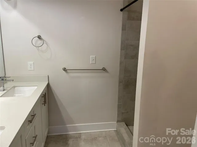 a bathroom with a sink and mirror