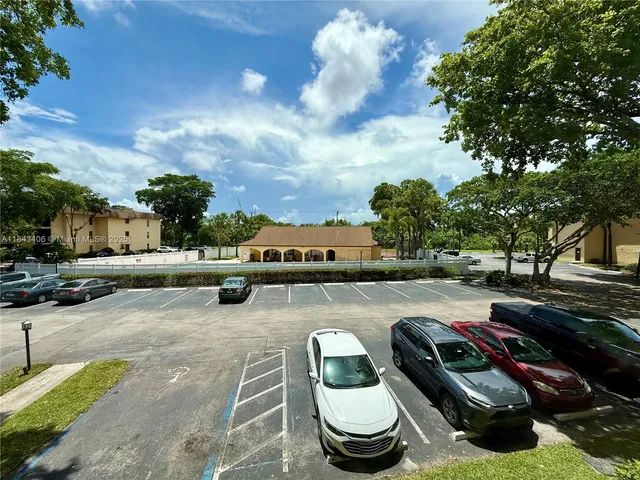 a view of a terrace with swimming pool and furniture