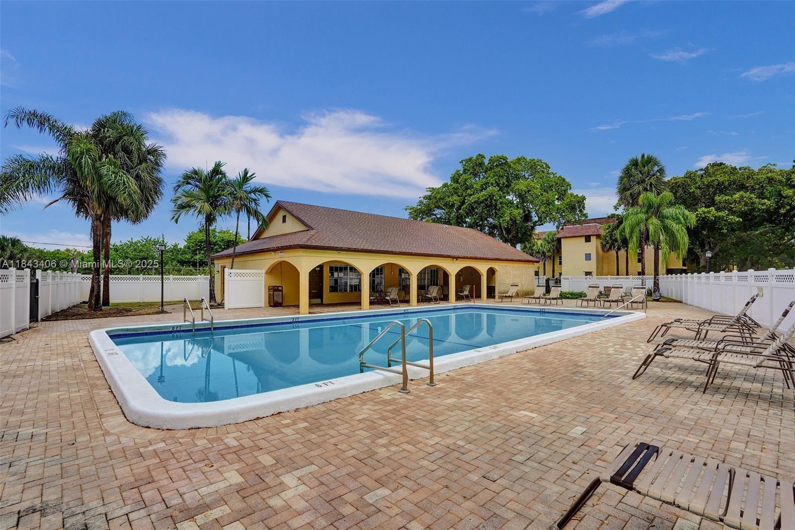 480 Northwest 20th Street, Unit 207 Boca Raton, FL 33431 - Photo 20 of 26 a view of swimming pool with outdoor seating and plants