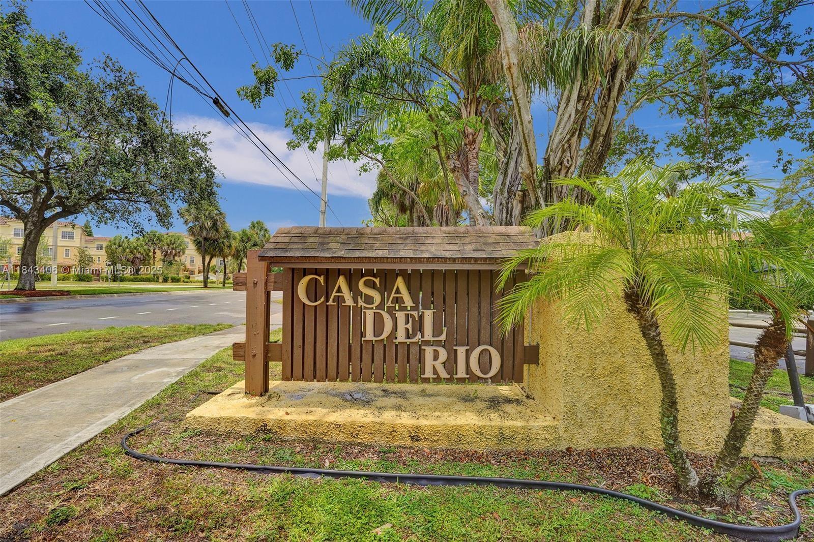 480 Northwest 20th Street, Unit 207 Boca Raton, FL 33431 - Photo 25 of 26 a view of outdoor space with sign board