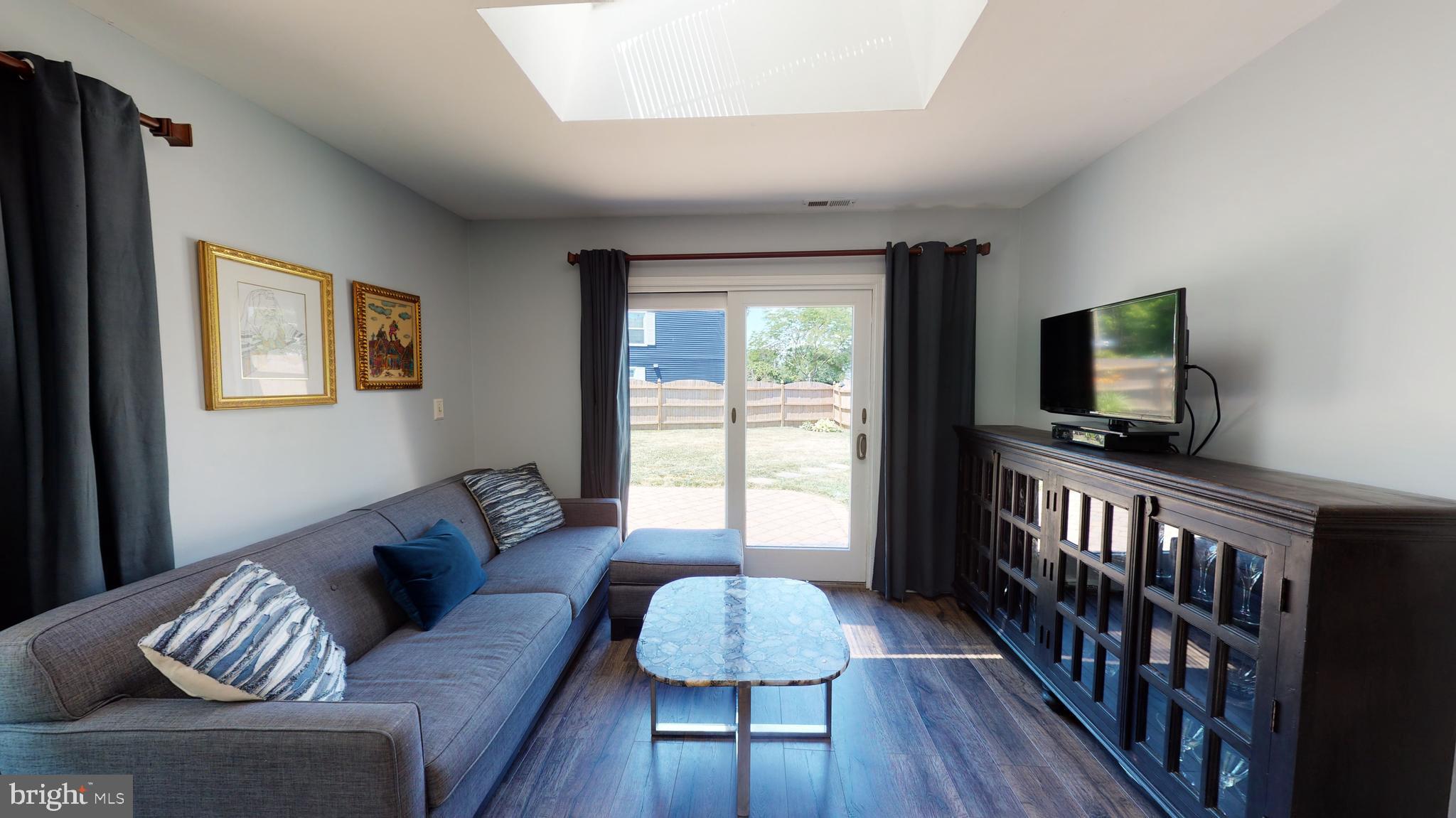 5 Carlton Avenue Evesham, NJ 08053 - Photo 14 of 33 a living room with furniture and a flat screen tv