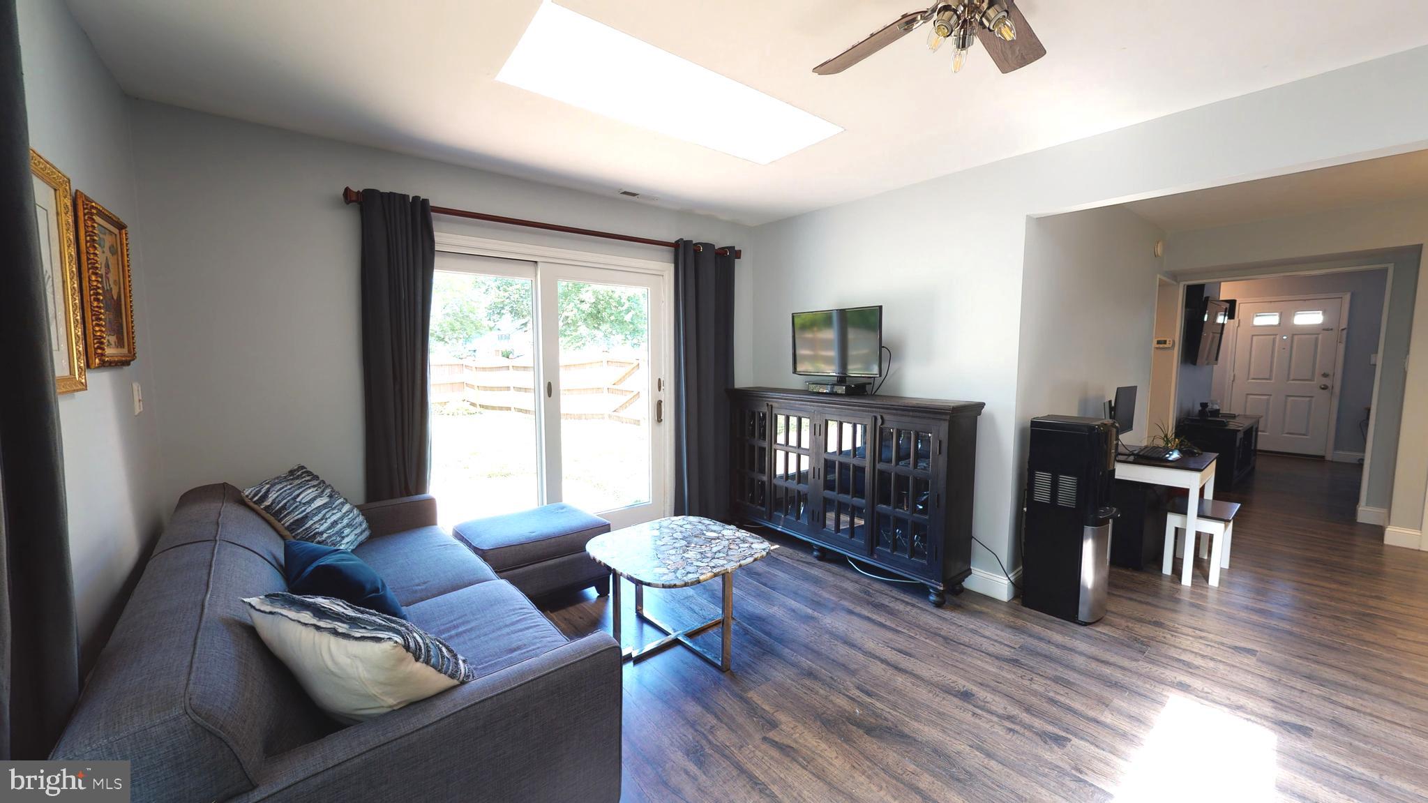 5 Carlton Avenue Evesham, NJ 08053 - Photo 15 of 33 a living room with furniture and a wooden floor
