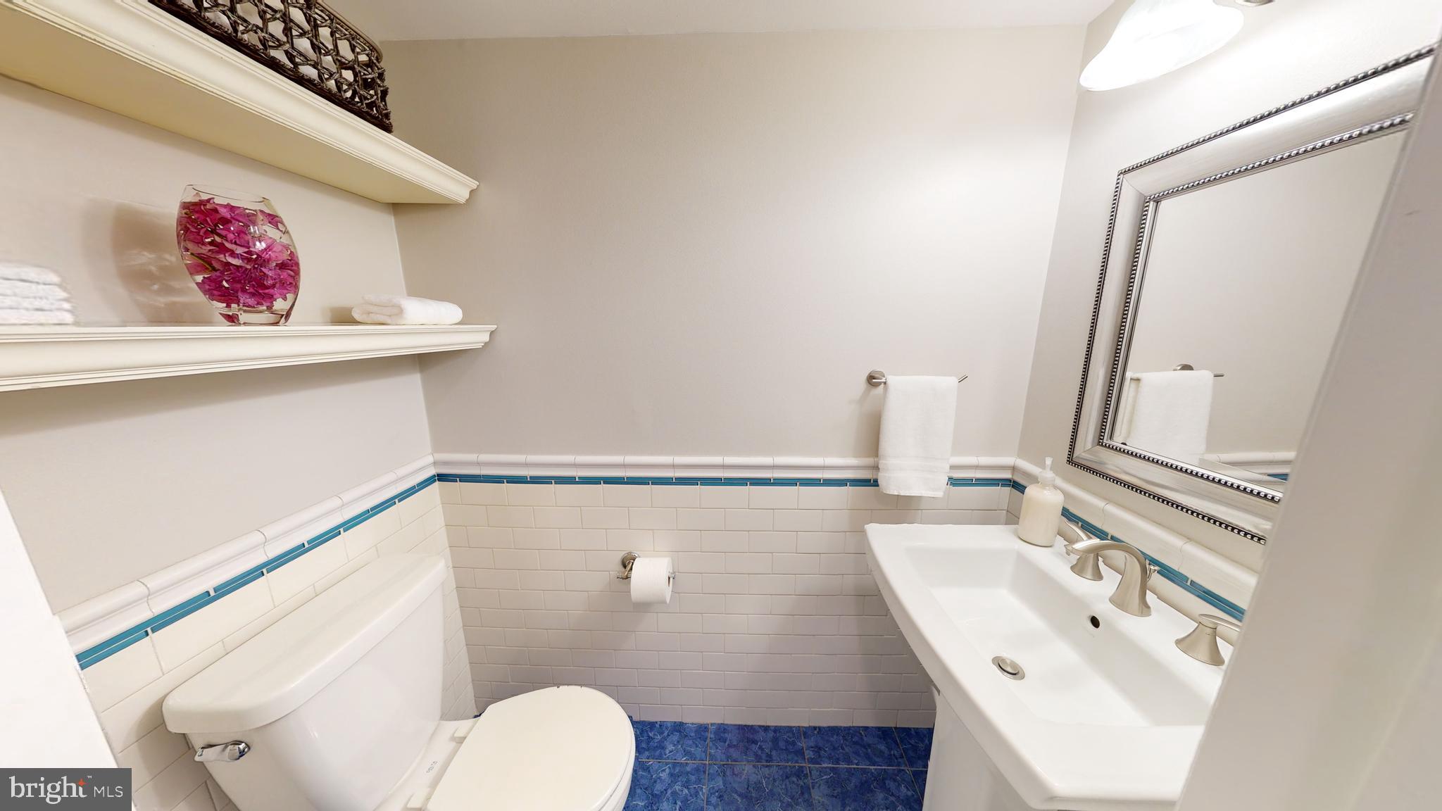 5 Carlton Avenue Evesham, NJ 08053 - Photo 17 of 33 a bathroom with a sink and a mirror