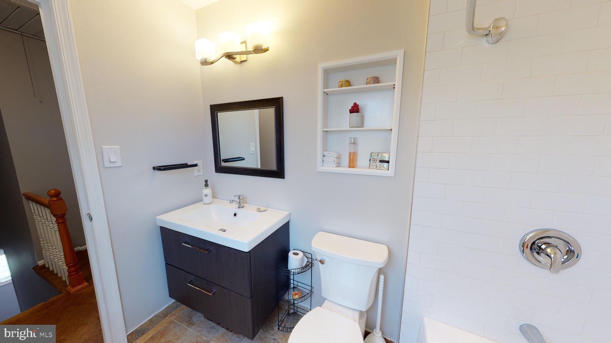 5 Carlton Avenue Evesham, NJ 08053 - Photo 20 of 33 a bathroom with a sink mirror vanity and toilet