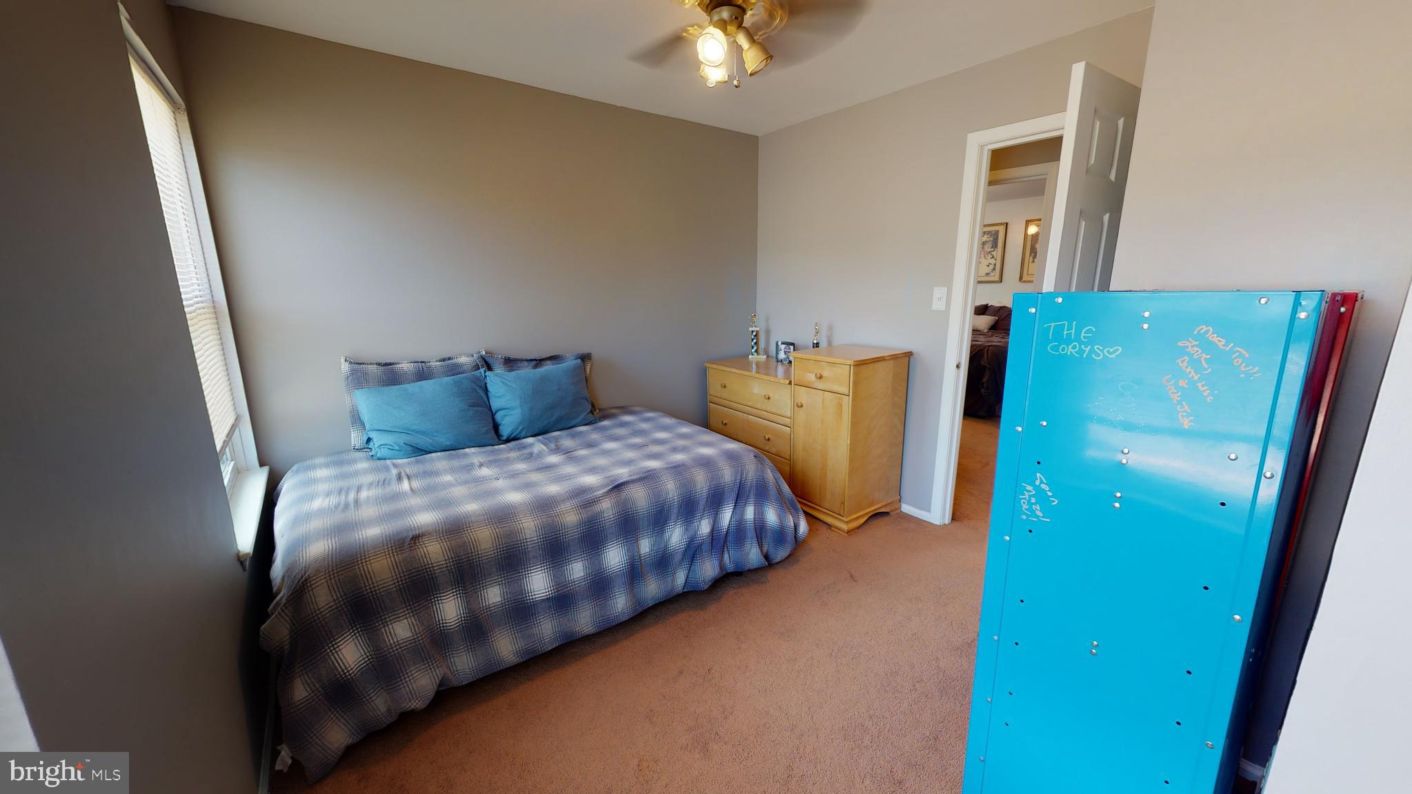 5 Carlton Avenue Evesham, NJ 08053 - Photo 24 of 33 a bedroom with a bed and a chandelier