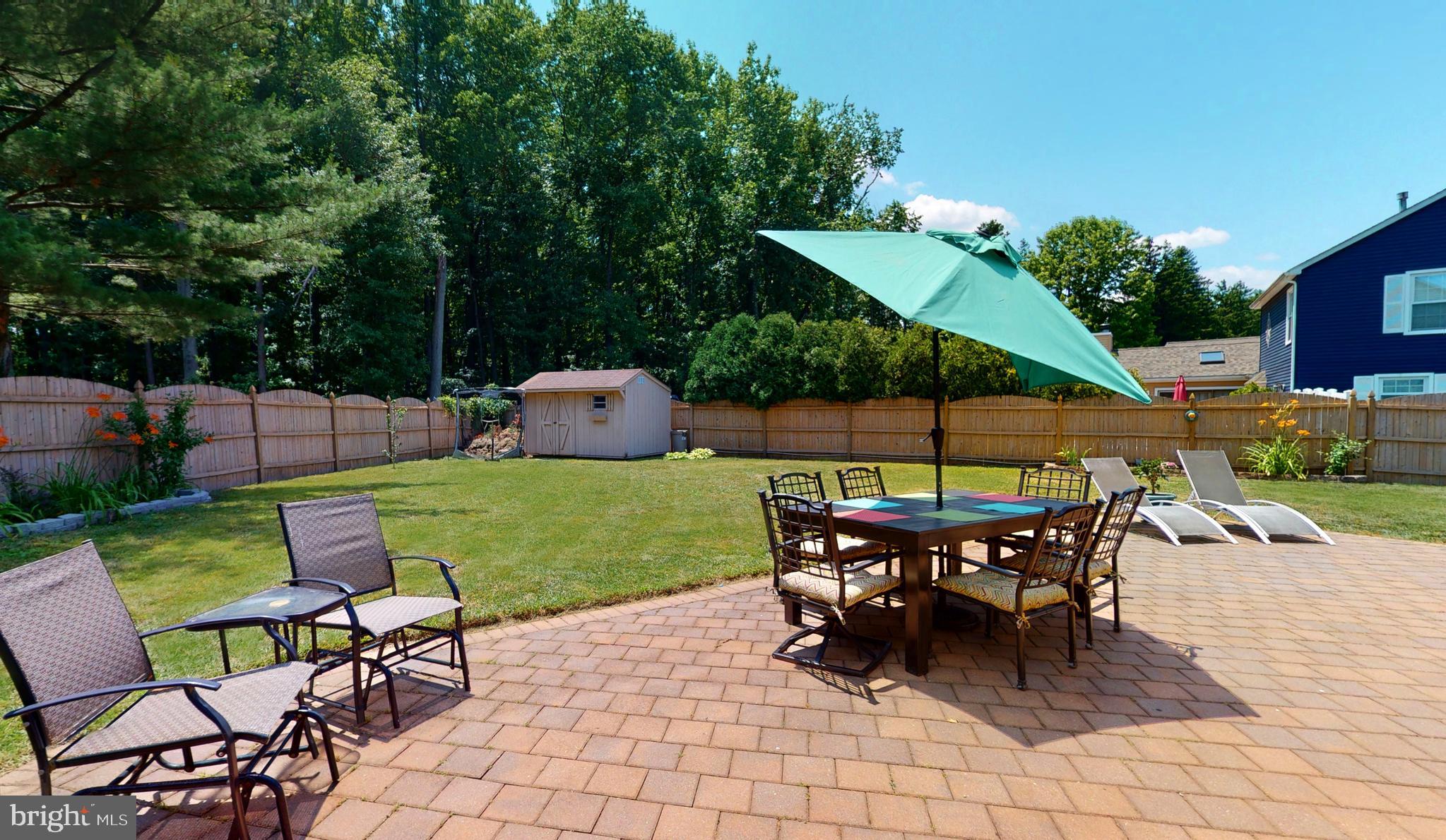 5 Carlton Avenue Evesham, NJ 08053 - Photo 30 of 33 an outdoor space with furniture and umbrella
