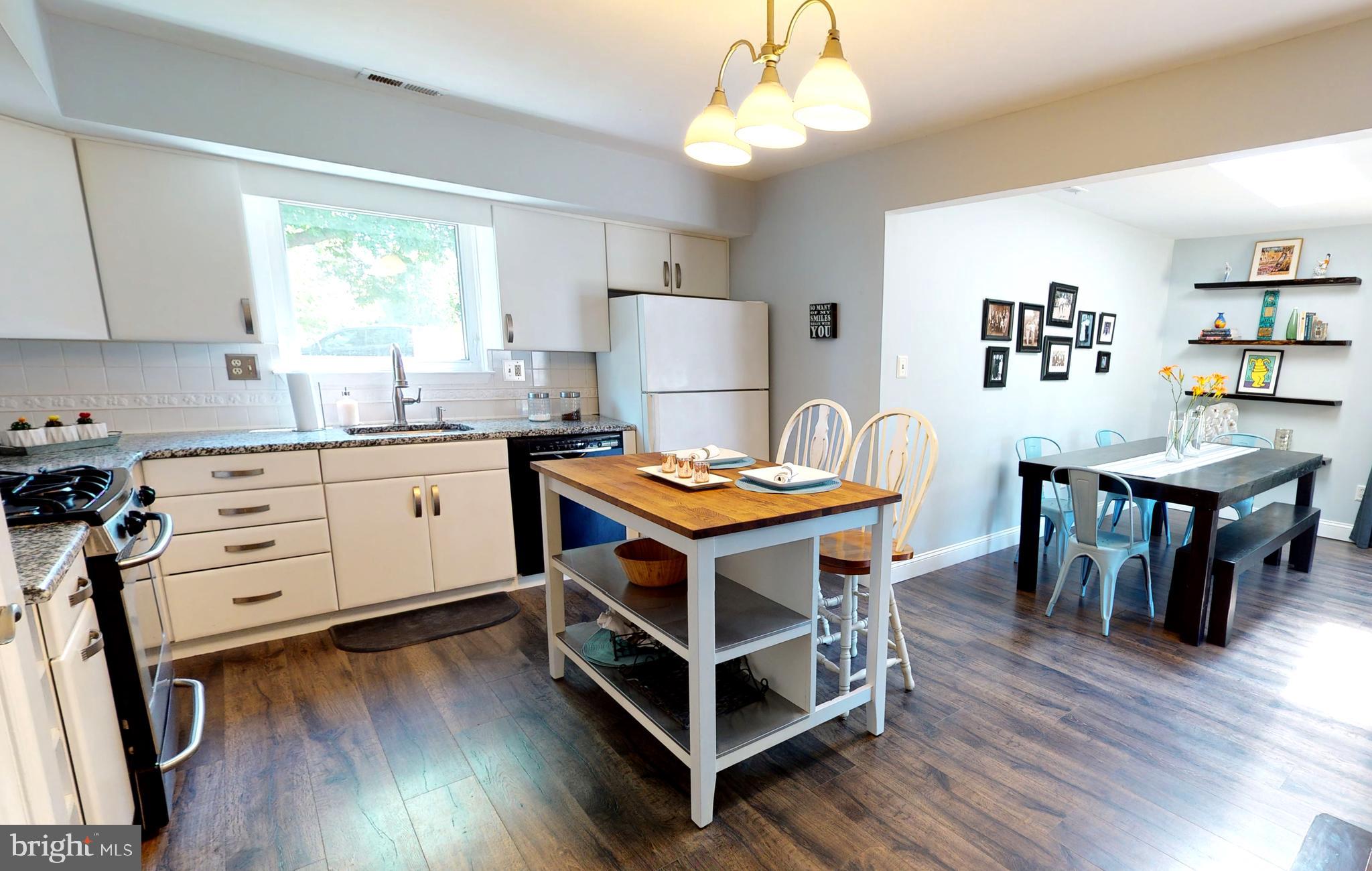 5 Carlton Avenue Evesham, NJ 08053 - Photo 6 of 33 a living room with a dining table wooden floor and a window