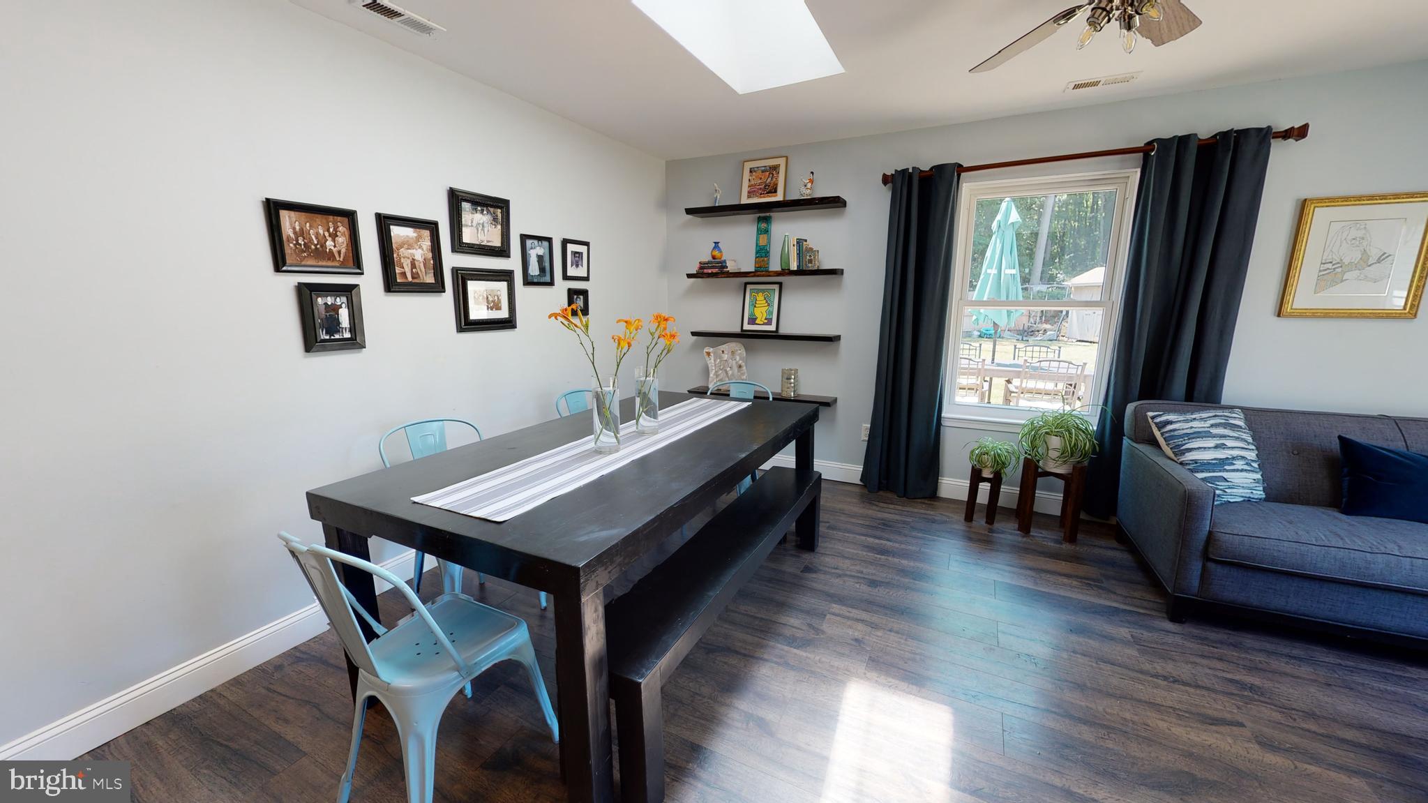 5 Carlton Avenue Evesham, NJ 08053 - Photo 10 of 33 a living room with furniture a table and a large window