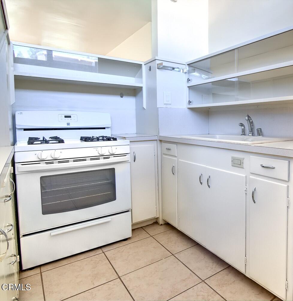 58 Avenue 64 Pasadena, CA 91105 - Photo 4 of 10 a stove top oven sitting inside of a kitchen