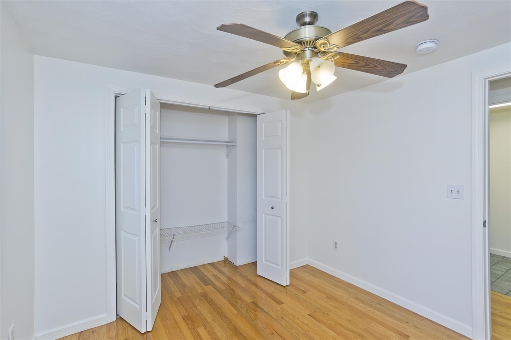 22 Pine View Three Rivers, MA 01080 - Photo 15 of 25 a bedroom with a bed and a chandelier