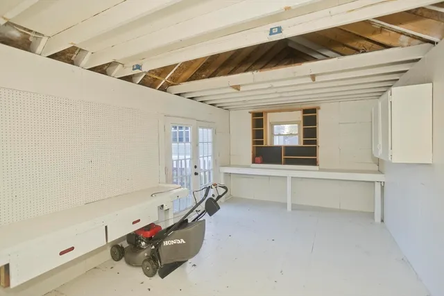 a room with gym equipment and view of living room