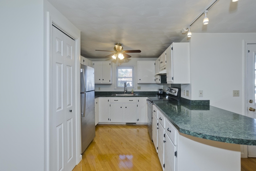 22 Pine View Three Rivers, MA 01080 - Photo 4 of 25 a large kitchen with a lot of counter space and a sink