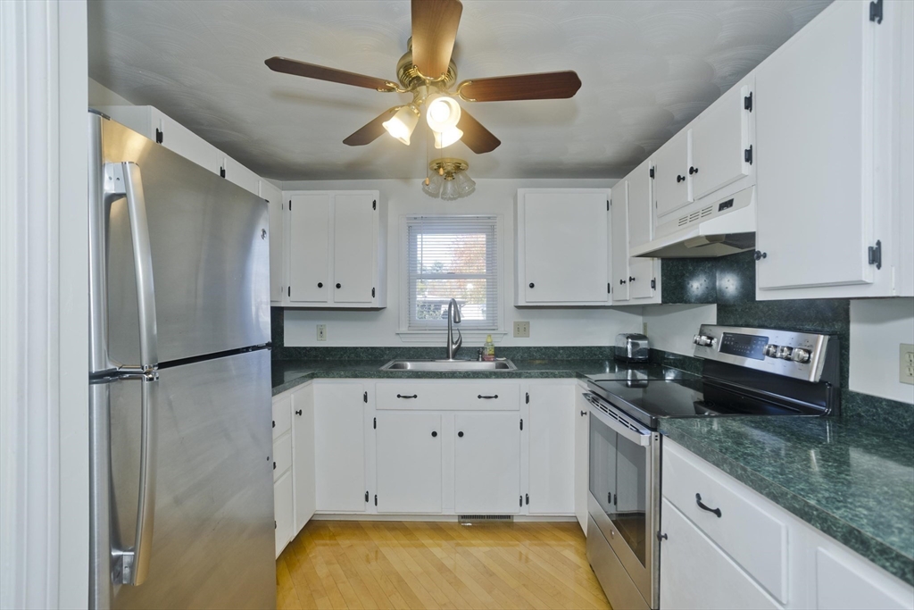 22 Pine View Three Rivers, MA 01080 - Photo 6 of 25 a kitchen with granite countertop a sink stainless steel appliances and cabinets