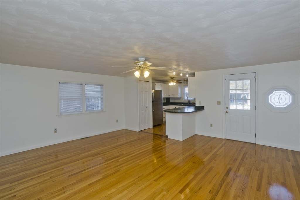 22 Pine View Three Rivers, MA 01080 - Photo 9 of 25 a view of a room with a window and wooden floor